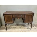 An Edwardian mahogany and inlaid dressing table, the surface cross banded above a pull brushing