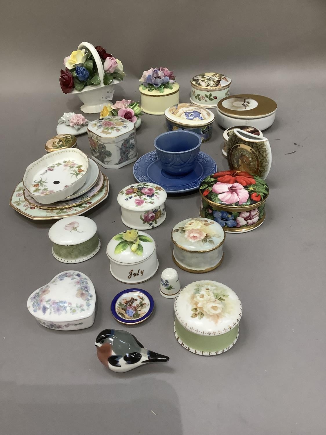 A collection of china flower clusters, trinket boxes, trinket dishes, cabinet cups and saucer etc