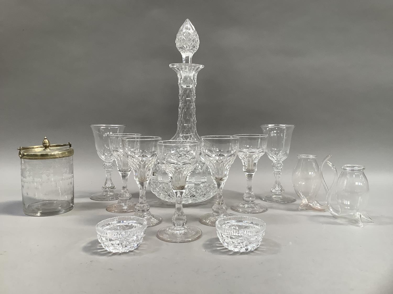 A cut glass sherry decanter together with five long stemmed panel cut sherry glasses on conical