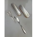 A pair of silver hairbrushes, Sheffield 1904/15, a pair of plated glove stretchers and a shoe horn