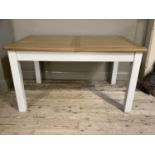 An oak and grey painted extending dining table, rectangular, on square legs, 140cm long extending to