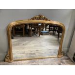 A gilt over mantle mirror