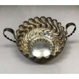 A Victorian silver two handled bon bon dish, circular outline of embossed wrythern stem type