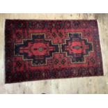 A middle eastern rug of red ground