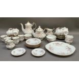 A Paragon china tea and coffee service of Victoriana rose pattern comprising teapot, coffee pot, two