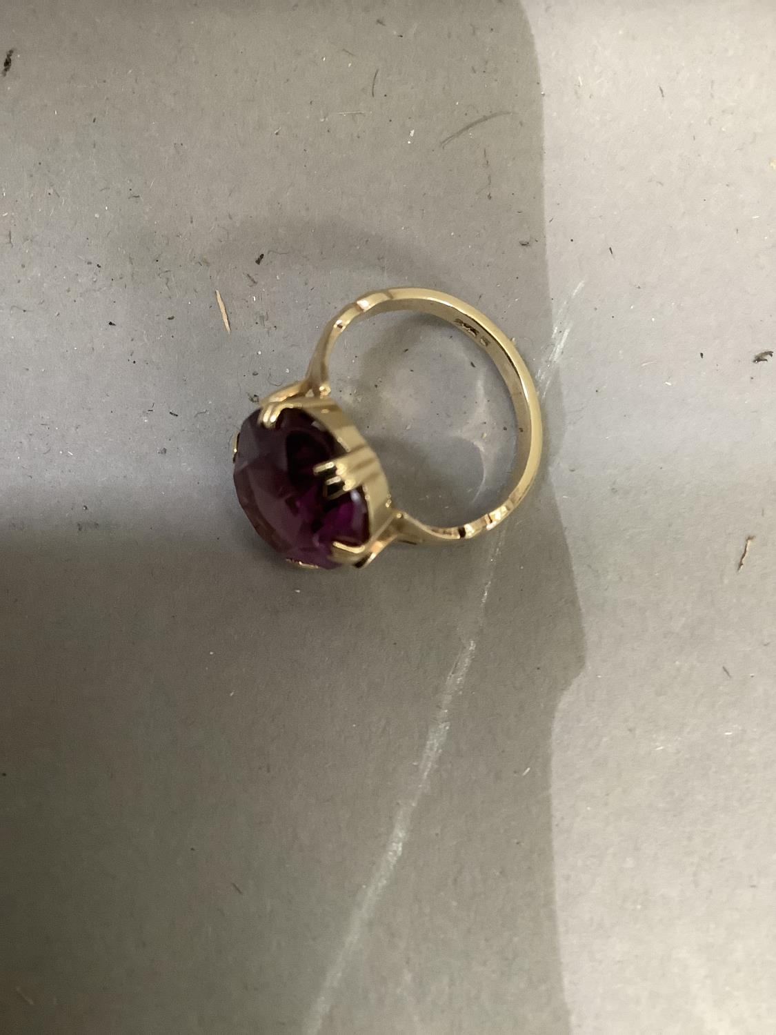 A dress ring c.1950 claw set in 9ct gold with an oval faceted purple paste, approximate weight 4g - Image 2 of 2