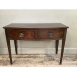 A mahogany bow fronted side table with two drawers and on square legs, 105cm wide