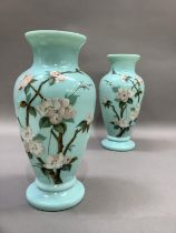 A pair of Victorian duck egg blue glass vases of baluster form, hand painted with apple blossom,