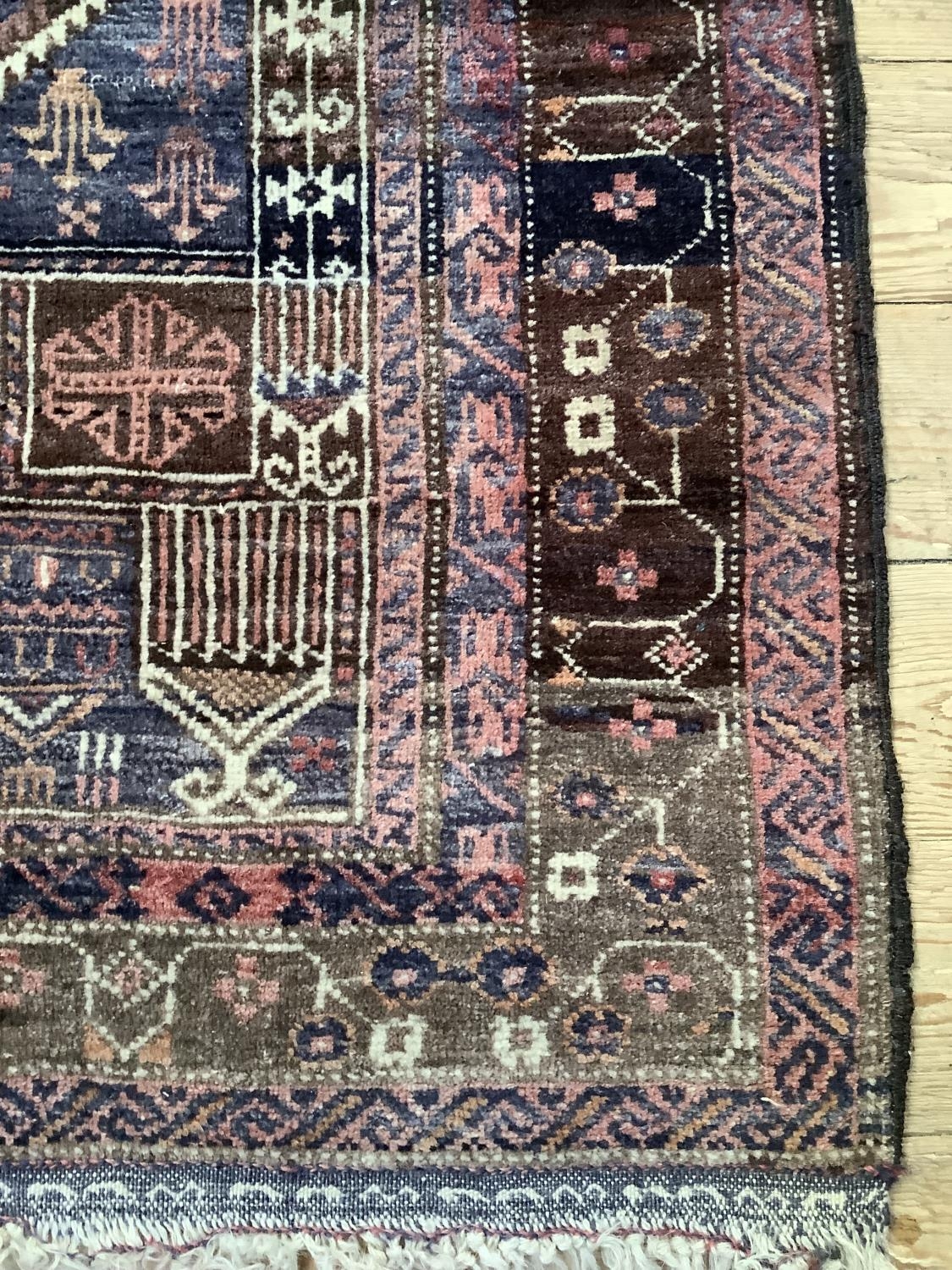 A Middle Eastern rug, the blue field woven with a stylised vase of flowers within multiple - Image 3 of 4