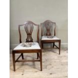 A pair of 19th century mahogany single chairs having an arched top rail over a pierced vase splat