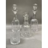 A pair of 19th century decanters of mallet shape, the blown panel stoppers inset with tear, panel