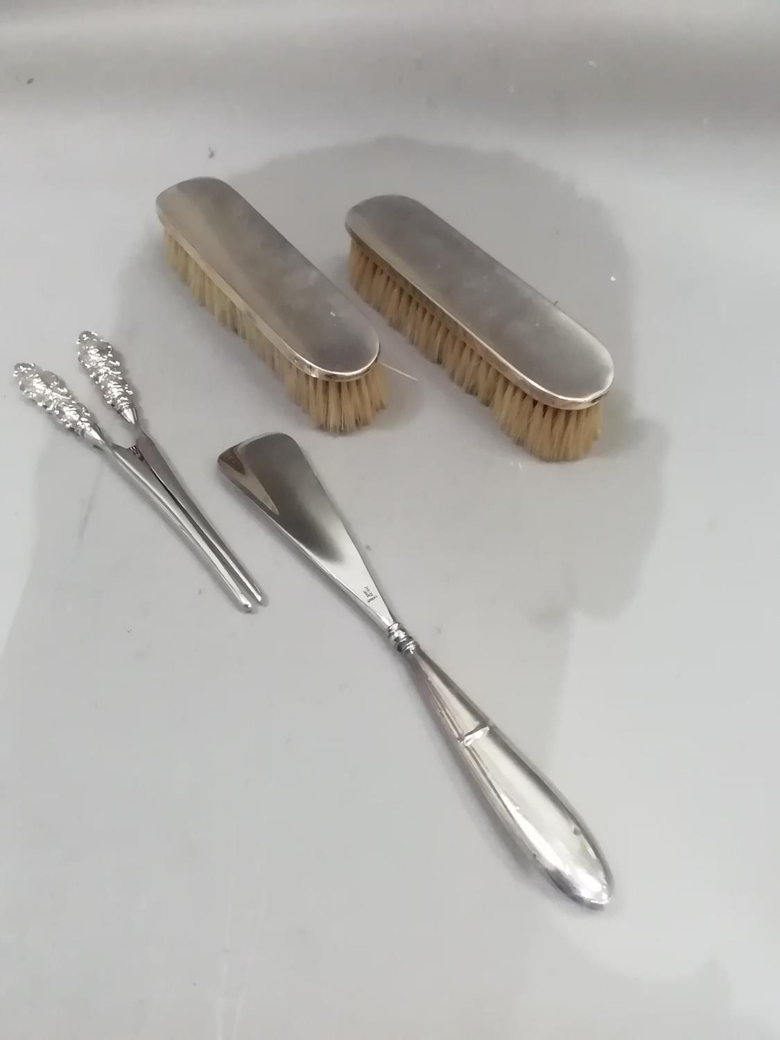 A pair of silver hairbrushes, Sheffield 1904/15, a pair of plated glove stretchers and a shoe horn - Image 2 of 2