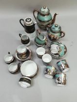 A Japanese coffee set painted with deities and attendants, comprising coffee pot, milk jug, lidded