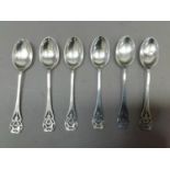 A set of six George VI silver coffee spoons with pierced scroll hafts, Sheffield 1938