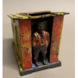 A late 19th century American cast iron money box modelled as an African-American standing at the