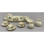 A W. H. Goss porcelain miniature tea service on an oval tray (16cm long) comprising teapot, milk