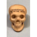 A W. H. Goss bisque porcelain skull, souvenir of the Hythe Crypt, 3.5cm high