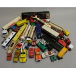 A collection of care worn die cast models of lorries, vans, tankers and fire trucks, including