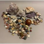 A collection of mineral specimens, polished stones amethyst crystal geode and a turned yew-wood
