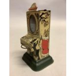 An early 20th century tinplate chocolate dispenser, possibly German, of vending machine form with