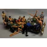 Thirteen Action Man figures, including clockwork swimming model, along with a Jeep, a motorbike