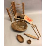 A doll's pine clothes horse, wicker wash basket, clothes line posts, four pegs, five wooden coat
