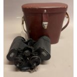 A pair of Carl Zeiss Jena' Jenoptem' 10x50W binoculars no. 5084294, brown leather carrying case