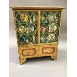 A rare Huntley & Palmer printed biscuit tin modelled as a display cabinet on bracket feet, etched
