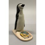 A W. H. Goss porcelain model of a penguin with Falkland Islands crest, printed mark 'W. H. Goss