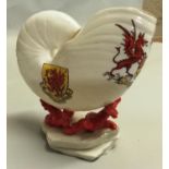 A W. H. Goss porcelain nautilus shell with Arms of Wales, Red Dragon of Wales and Llanfairfechan