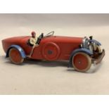 A Meccano Ltd tin plate clockwork racing car and driver c.1930s, in red with blue mudguards,