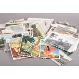 British Isles: A quantity of early 20th century colour and monochrome postcards together with ten