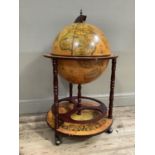 A terrestrial globe drinks cabinet