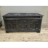 Late 17th/early 18th century oak kist, all over carved with stiff leaf rims and borders, the