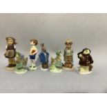 A Coalport figure of Paddington as a chimney sweep, another of a hare, two speckledy hens and a
