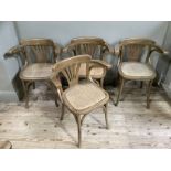 A set of four bent wood elbow chairs