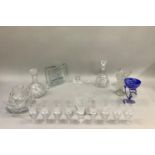 A selection of glassware including cut glass decanters, fruit bowl, water jug, wines, miniature