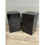A pair of black Perspex stands of square outline