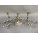 A quantity of silver plated teaspoons and coffee spoons and a three light candelabra