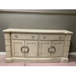 A cream wood effect four door sideboard with two long drawers