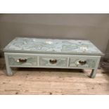 A chinoiserie decorated coffee table in duck egg blue