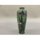 A Japanese cloisonné vase of slender tapered form decorated in mauve and white with iris against a