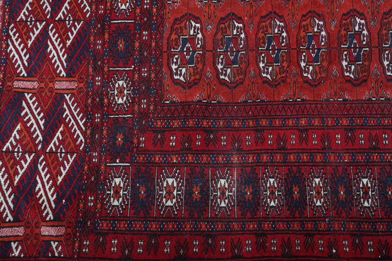 A BOKHARA RUG OF FOX RED GROUND filled with three rows of thirteen 'elephant foot' medallions within - Image 2 of 4
