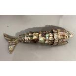 A New Zealand Paua shell model of a reticulated fish 19cm long.