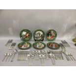 A canteen of silver plated cutlery together with a set of six Limoges decorative plates