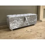 A grey crushed velvet ottoman with buttoned top, 103cm wide