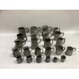 A quantity of pewter tankards, pint mugs etc