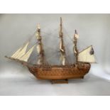 A teak model of HMS Victory, approximately 110cm wide by 74cm high