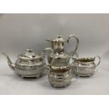 A Victorian four piece silver plated tea service of oval outline and half reeded and embossed body