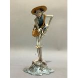 A mid 20th century Italian ceramic figure of a man bending over and pointing